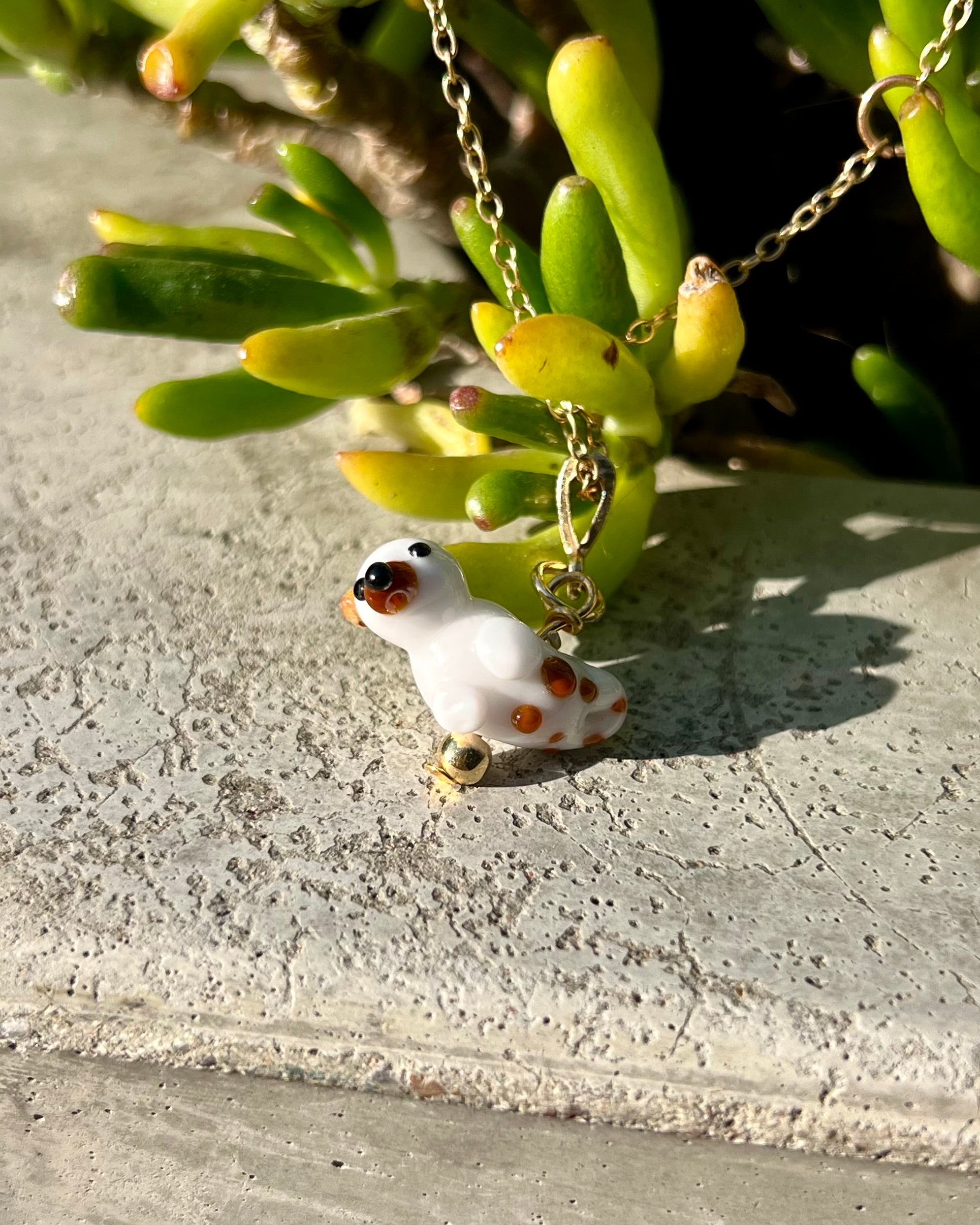 otter glass bead